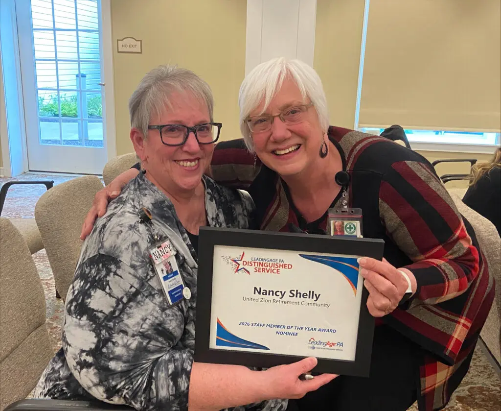 CEO, Sue Verdegem presents Nancy Shelley with a certificate for her nomination.