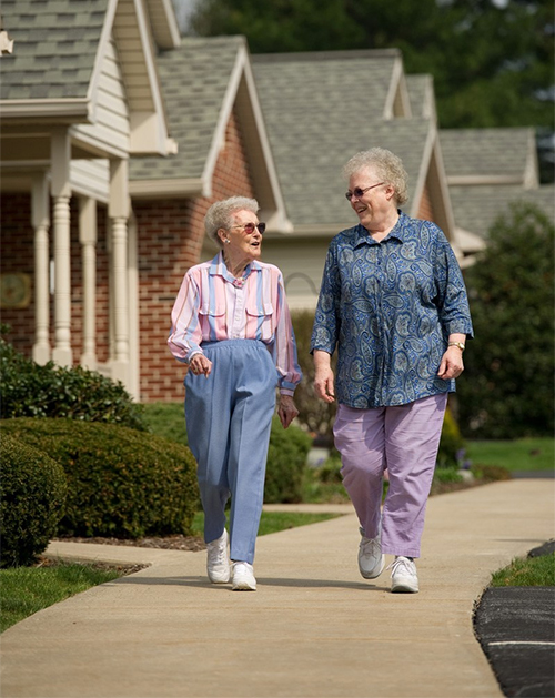 Two members of the senior independent living cottage community taking a walk | United Zion Retirement Community