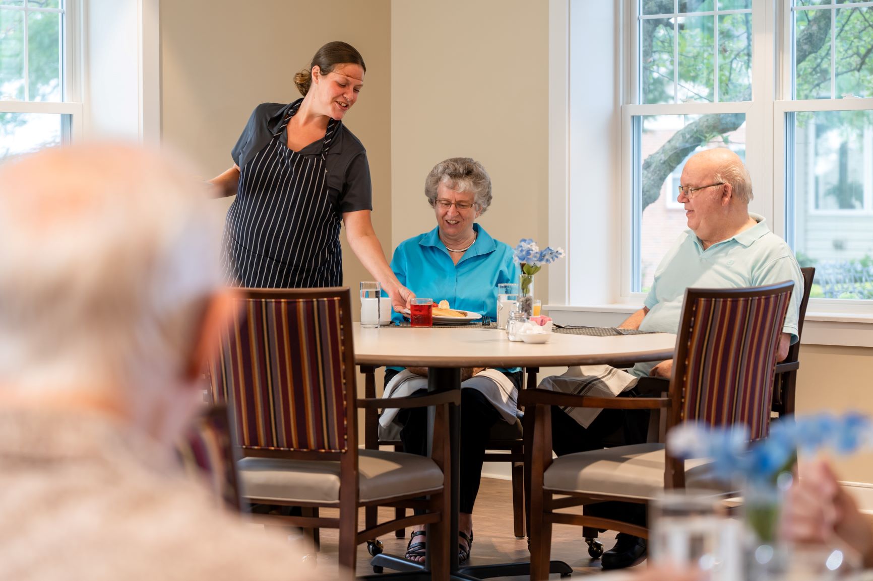 Senior Residents, and new apartment owners enjoy a meal in Lexington Restaurant at the UZRC Lititz, PA Campus