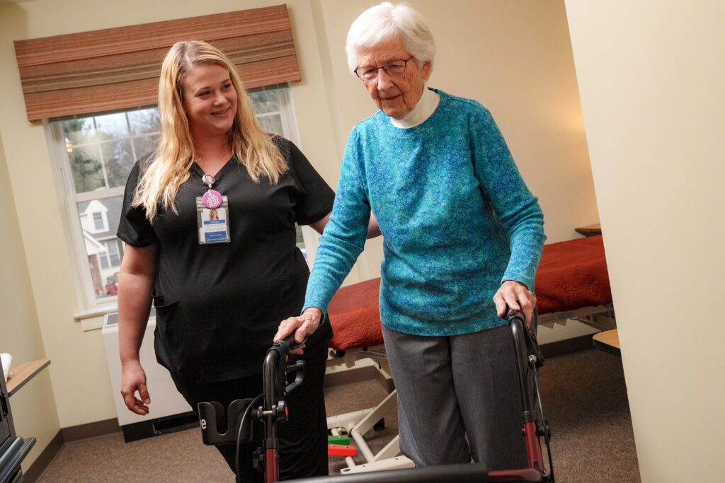 A nurse assisting a long-term care resident at UZRC in Lititz, PA